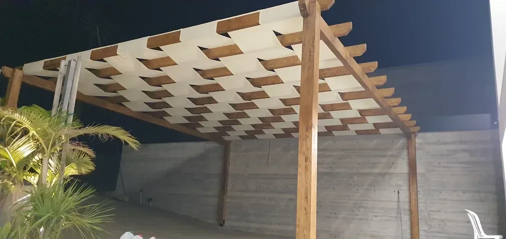 Pergola posts and canopy over the courtyard