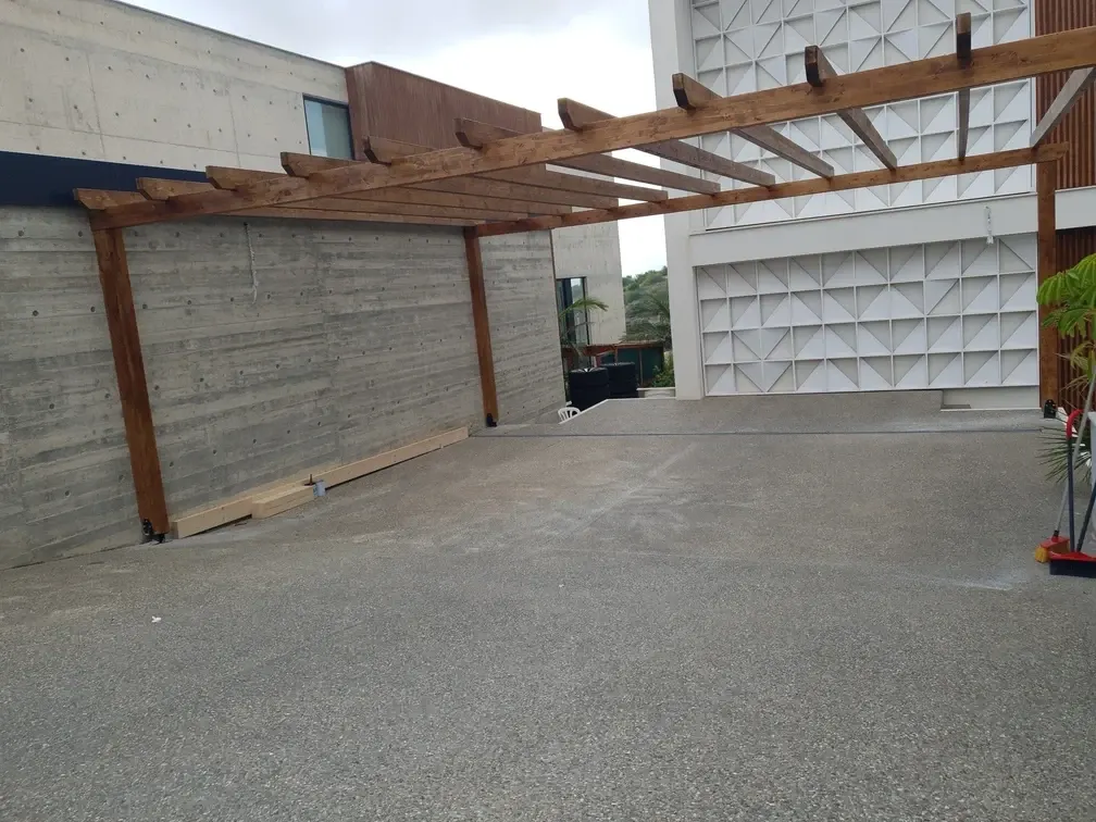 The finished pergola frame seen across the terrace