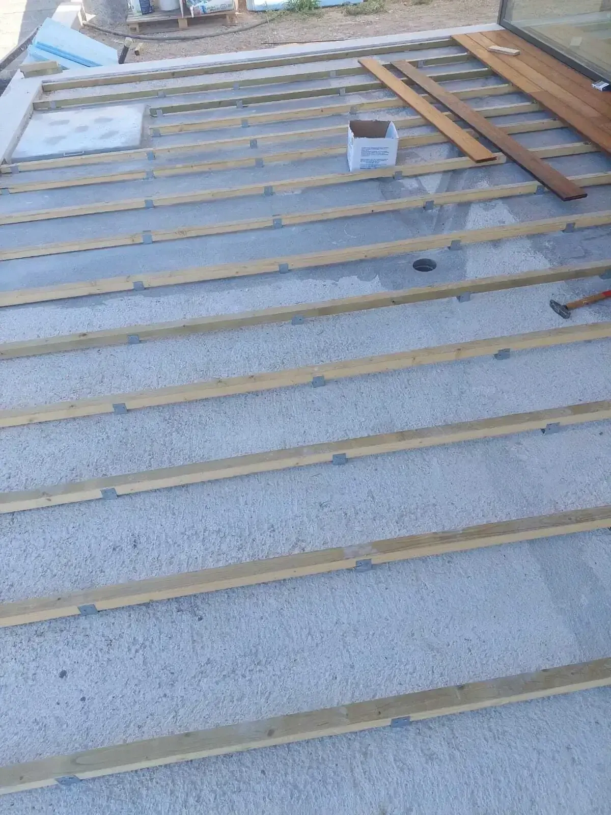 Timber subframe of joists laid out before the boards were fixed
